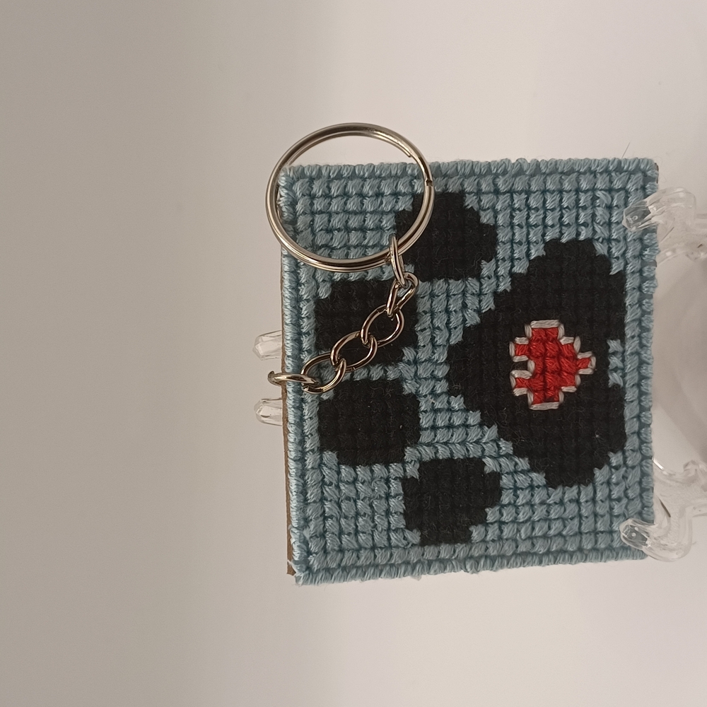 Handcrafted Paw Print Blue Keychain with Black and Red Heart Design